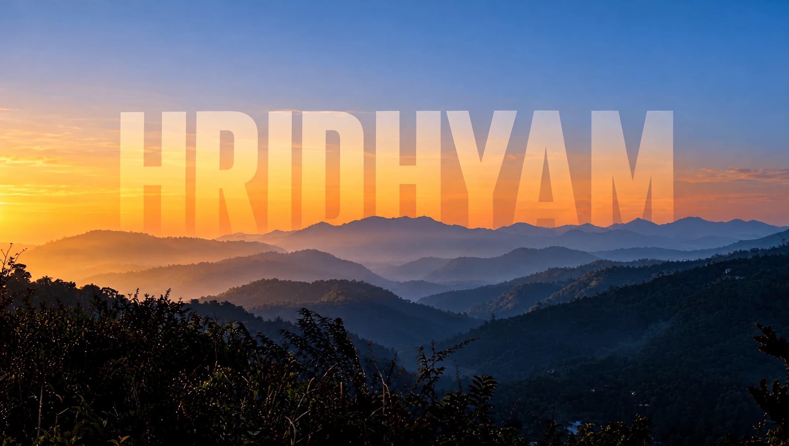 Sunrise over the ridges of the Doon Valley, the name Hridhyam across the horizon